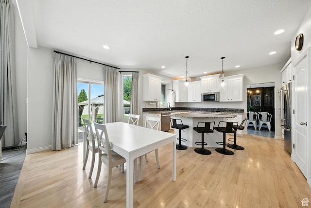 3072 W Current Creek Dr, South Jordan, UT 84095 - dining room with light wood finished floors and recessed lighting