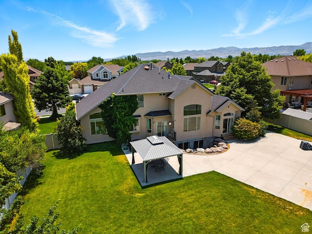 3072 W Current Creek Dr, South Jordan, UT 84095 - back of property featuring a gazebo, a residential view, a mountain view, stucco siding, and a shingled roof