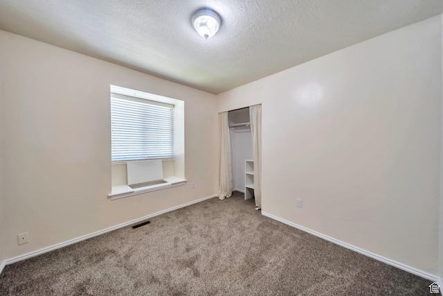 5072 S 1150 E, Ogden, UT 84403 - unfurnished bedroom with carpet floors, a textured ceiling, and a closet
