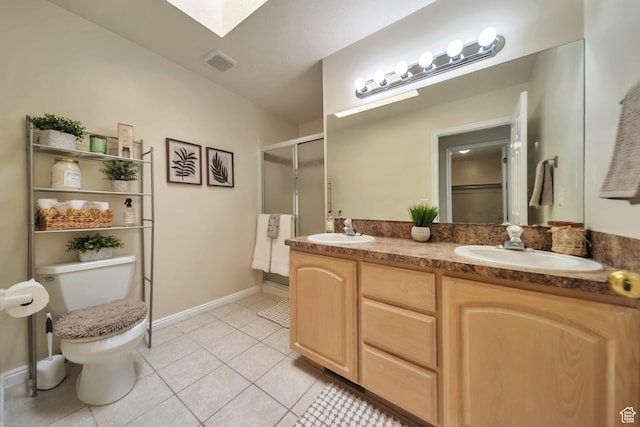 5072 S 1150 E, Ogden, UT 84403 - full bathroom featuring tile patterned floors, a shower stall, double vanity, and a skylight