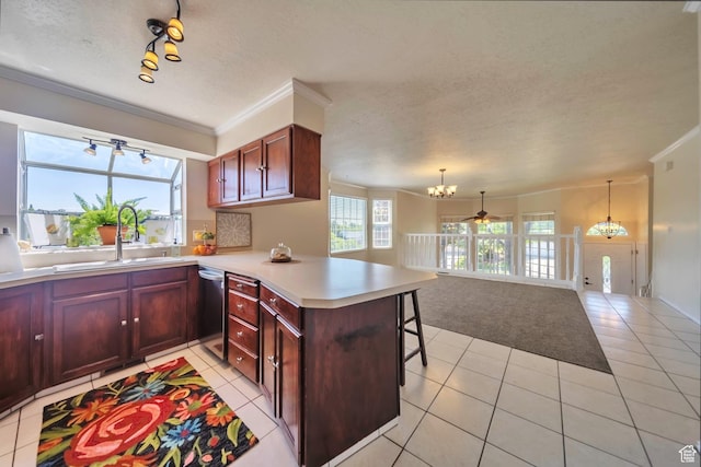 5072 S 1150 E, Ogden, UT 84403 - kitchen featuring a chandelier, a peninsula, crown molding, light tile patterned floors, and dishwasher