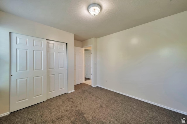 5072 S 1150 E, Ogden, UT 84403 - unfurnished bedroom with carpet flooring, a closet, and a textured ceiling