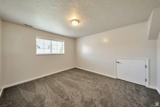5072 S 1150 E, Ogden, UT 84403 - unfurnished room featuring dark colored carpet and a textured ceiling