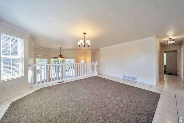5072 S 1150 E, Ogden, UT 84403 - spare room with a chandelier, light tile patterned floors, crown molding, a textured ceiling, and plenty of natural light
