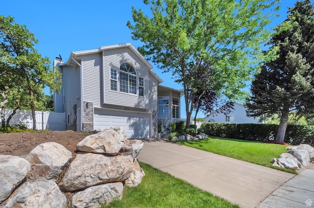 5072 S 1150 E, Ogden, UT 84403 - view of front of property featuring driveway, a garage, and stone siding