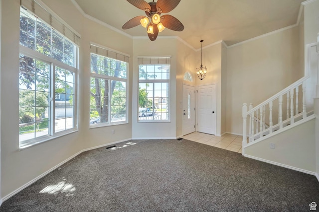 5072 S 1150 E, Ogden, UT 84403 - entrance foyer featuring healthy amount of natural light, carpet, a chandelier, a ceiling fan, and crown molding