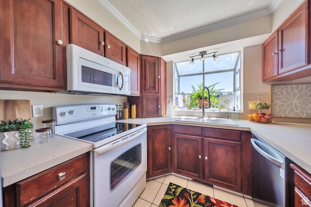 5072 S 1150 E, Ogden, UT 84403 - kitchen featuring white appliances, crown molding, light countertops, light tile patterned floors, and reddish brown cabinets