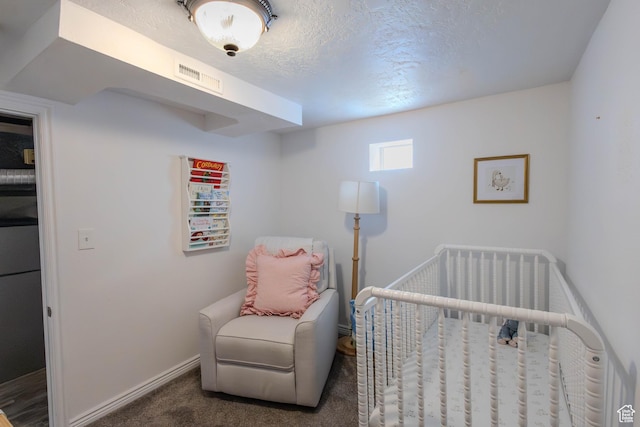 275 N 500 W, Price, UT 84501 - carpeted bedroom with a nursery area and a textured ceiling
