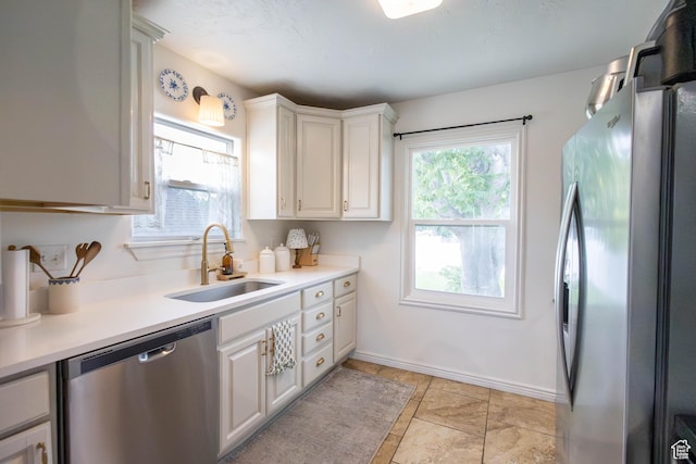 275 N 500 W, Price, UT 84501 - kitchen featuring stainless steel appliances, light countertops, and white cabinetry