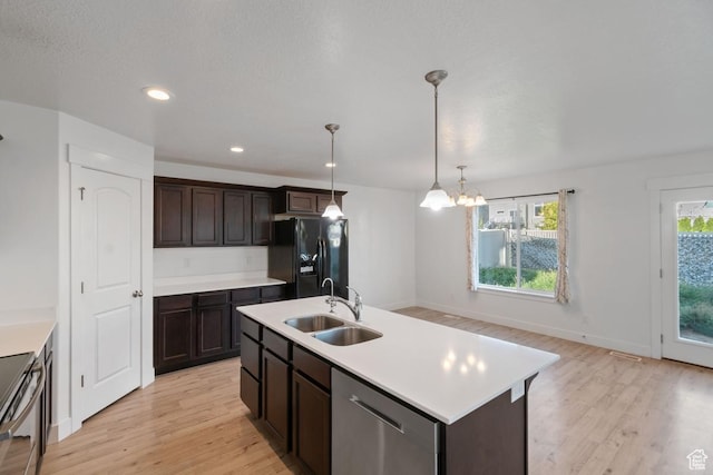194 N Valcrest Dr, Saratoga Springs, UT 84045 - kitchen featuring stainless steel dishwasher, black refrigerator with ice dispenser, light wood-style floors, stove, and a chandelier