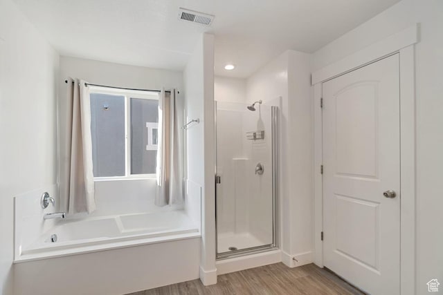 194 N Valcrest Dr, Saratoga Springs, UT 84045 - bathroom featuring a shower stall, a bath, and wood finished floors
