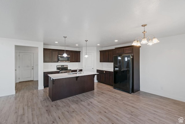 194 N Valcrest Dr, Saratoga Springs, UT 84045 - kitchen featuring stainless steel appliances, light wood-type flooring, dark brown cabinetry, recessed lighting, and light countertops