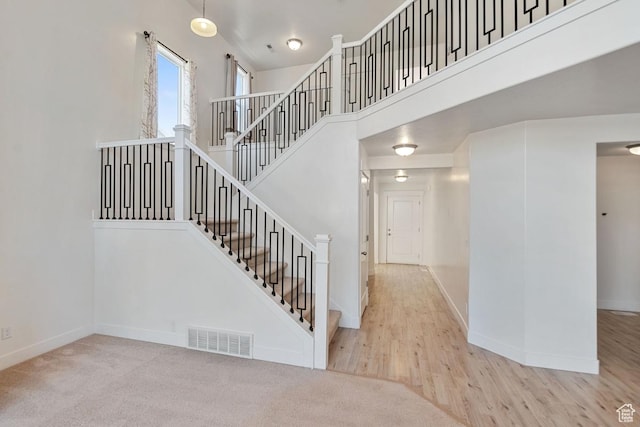 194 N Valcrest Dr, Saratoga Springs, UT 84045 - stairway with a high ceiling and carpet