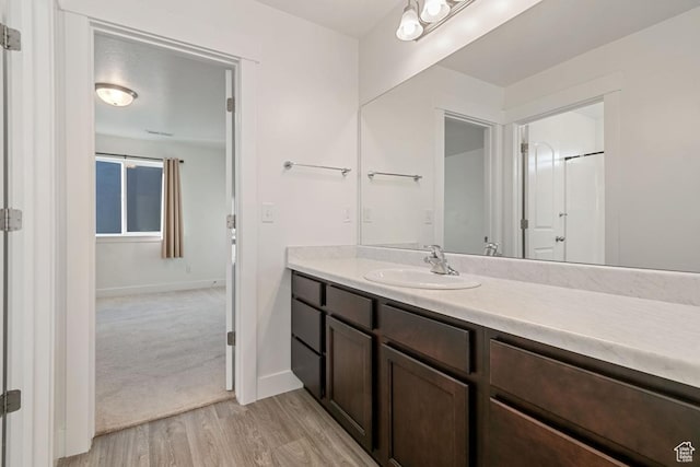 194 N Valcrest Dr, Saratoga Springs, UT 84045 - bathroom featuring vanity and wood finished floors