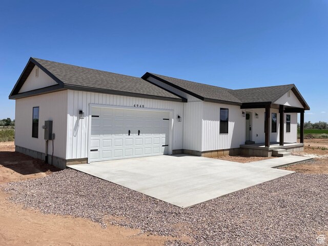 4940 N 5000 W, Roosevelt, UT 84066 - view of front facade with driveway, an attached garage, and roof with shingles
