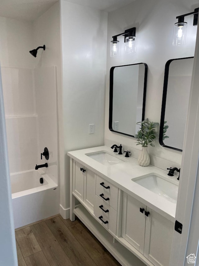 4940 N 5000 W, Roosevelt, UT 84066 - full bath with wood finished floors, double vanity, and shower / bathtub combination