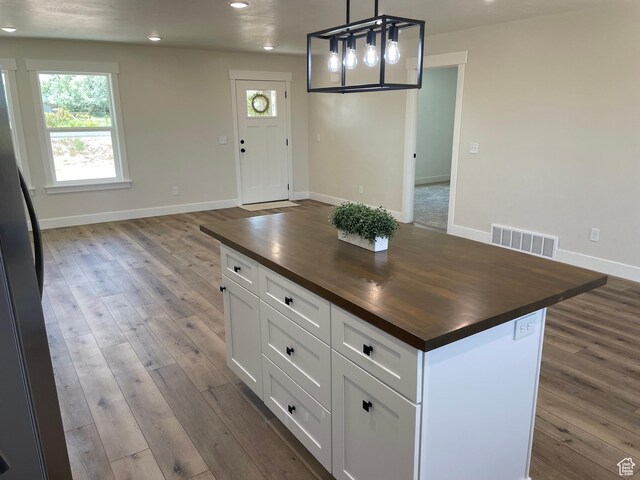 4940 N 5000 W, Roosevelt, UT 84066 - kitchen featuring butcher block counters, recessed lighting, plenty of natural light, and dark wood-type flooring