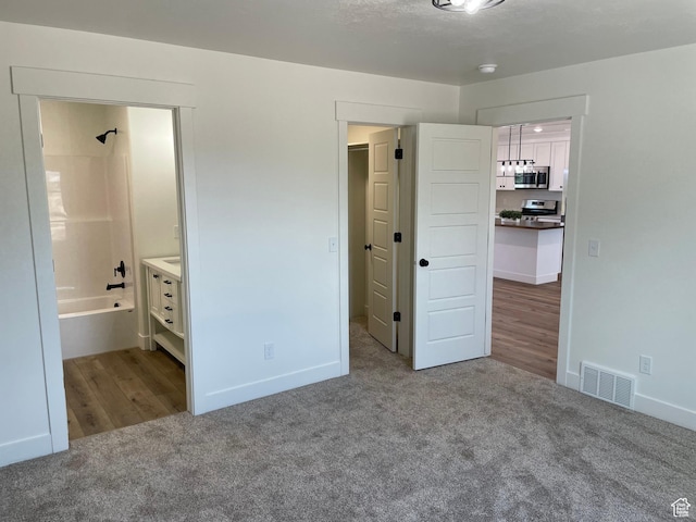 4940 N 5000 W, Roosevelt, UT 84066 - unfurnished bedroom with carpet and baseboards