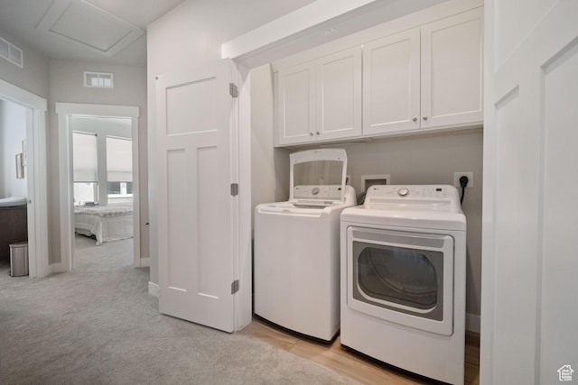 1044 S 2800 E, Spanish Fork, UT 84660 - laundry area featuring cabinet space, washing machine and dryer, attic access, and light carpet