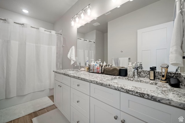 1044 S 2800 E, Spanish Fork, UT 84660 - bathroom featuring double vanity, wood finished floors, and shower / bath combination with curtain