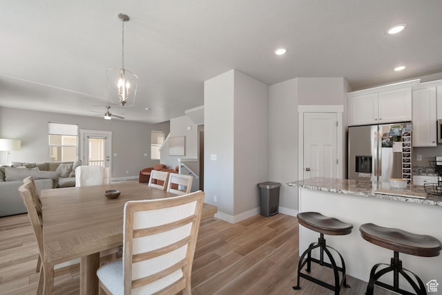 1044 S 2800 E, Spanish Fork, UT 84660 - dining area featuring light wood-style floors, recessed lighting, ceiling fan, and a chandelier