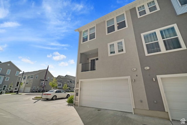 1044 S 2800 E, Spanish Fork, UT 84660 - view of building exterior with an attached garage and a residential view