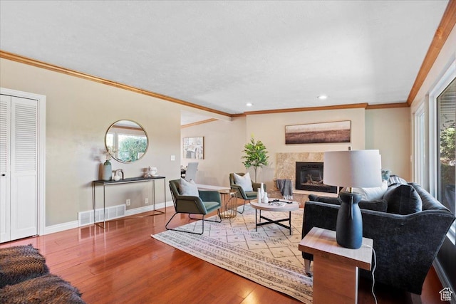 4549 S Tanglewood Dr E Unit 4549, Holladay, UT 84117 - living area featuring wood finished floors, a premium fireplace, ornamental molding, and recessed lighting
