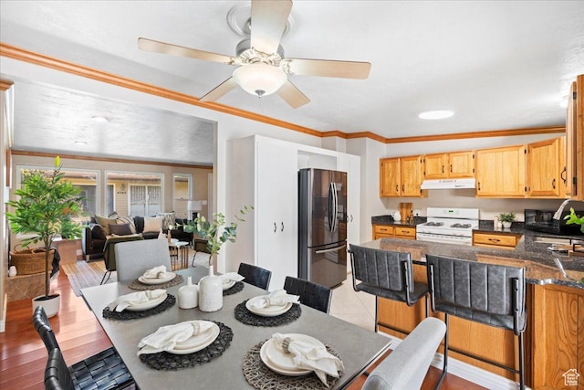 4549 S Tanglewood Dr E Unit 4549, Holladay, UT 84117 - dining space featuring crown molding and a ceiling fan