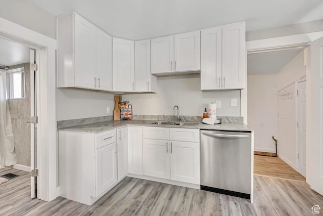 2056 Liberty Ave, Ogden, UT 84401 - kitchen with stainless steel dishwasher, white cabinets, and light wood-style flooring