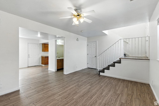 1731 W 800 N, Pleasant Grove, UT 84062 - unfurnished living room with wood finished floors, ceiling fan, and stairs