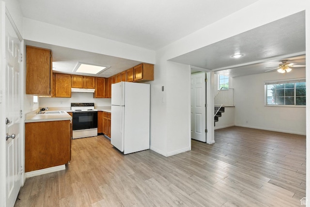 1731 W 800 N, Pleasant Grove, UT 84062 - kitchen featuring white appliances, brown cabinetry, light countertops, and light wood-style flooring