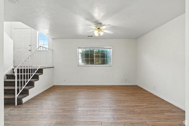 1692 W 680 N, Pleasant Grove, UT 84062 - unfurnished room featuring ceiling fan, wood finished floors, and stairway