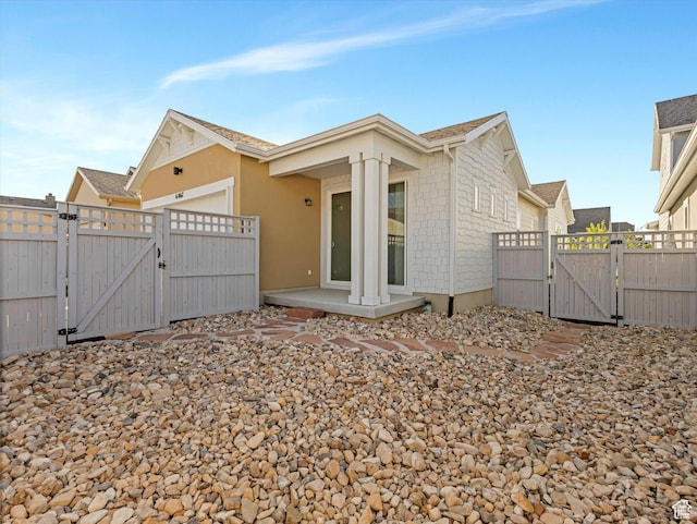 6067 W Whisle Stop Rd S, South Jordan, UT 84009 - back of property featuring a gate and an attached garage