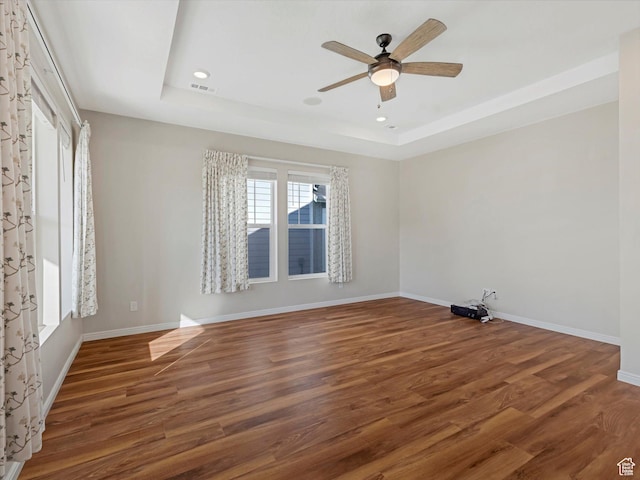 6067 W Whisle Stop Rd S, South Jordan, UT 84009 - empty room featuring a raised ceiling, ceiling fan, wood finished floors, and recessed lighting