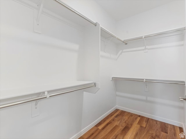 6067 W Whisle Stop Rd S, South Jordan, UT 84009 - walk in closet featuring wood finished floors
