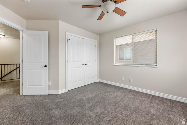 3315 W Birch Creek Rd S Unit 28D, West Haven, UT 84401 - unfurnished bedroom featuring carpet floors, a closet, and a ceiling fan