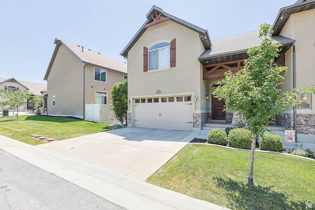 3315 W Birch Creek Rd S Unit 28D, West Haven, UT 84401 - view of front of home with an attached garage, stone siding, concrete driveway, and stucco siding