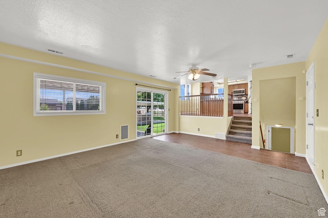 3972 S 4450 W, West Haven, UT 84401 - unfurnished living room featuring carpet, stairway, and ceiling fan