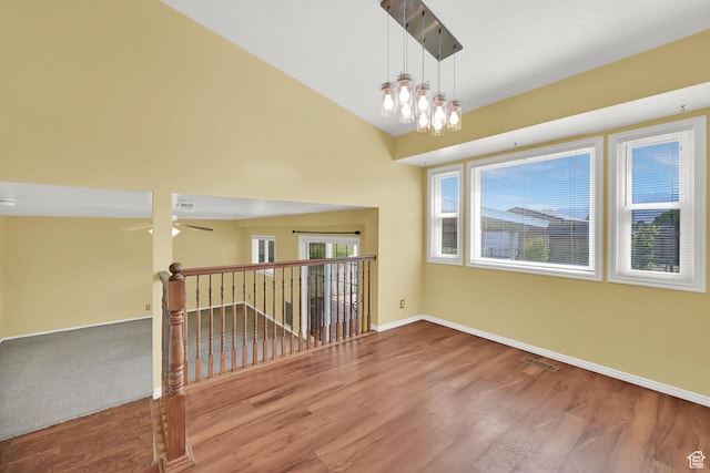 3972 S 4450 W, West Haven, UT 84401 - empty room with wood finished floors, plenty of natural light, and ceiling fan