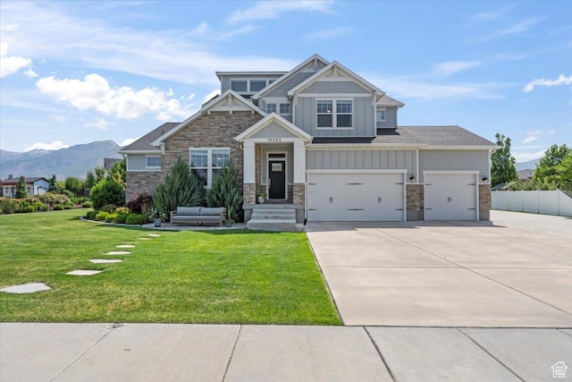 10262 N Yorkshire Cir, Highland, UT 84003 - craftsman inspired home featuring board and batten siding, driveway, stone siding, a mountain view, and a garage