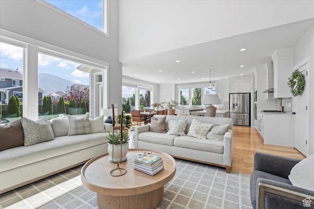 10262 N Yorkshire Cir, Highland, UT 84003 - living room with light wood-style flooring, recessed lighting, and a mountain view