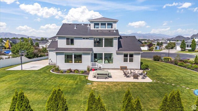 10262 N Yorkshire Cir, Highland, UT 84003 - back of property with a patio, a mountain view, and a residential view