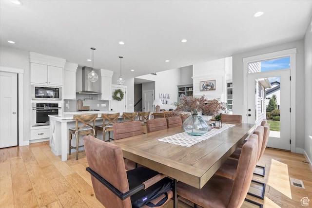 10262 N Yorkshire Cir, Highland, UT 84003 - dining area with light wood-style floors and recessed lighting