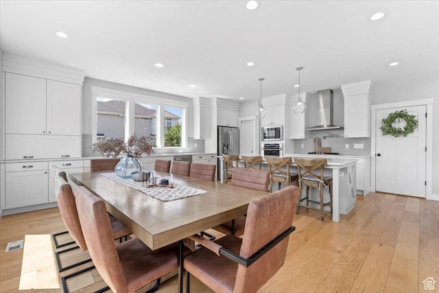 10262 N Yorkshire Cir, Highland, UT 84003 - dining area featuring light wood-style flooring and recessed lighting