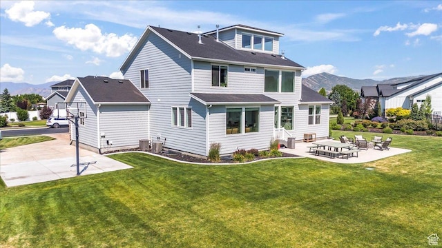 10262 N Yorkshire Cir, Highland, UT 84003 - rear view of house featuring a patio area, a mountain view, and a yard
