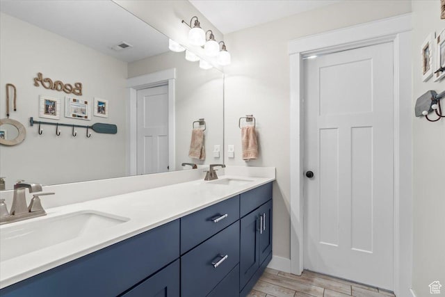 10262 N Yorkshire Cir, Highland, UT 84003 - full bathroom with double vanity and wood finished floors