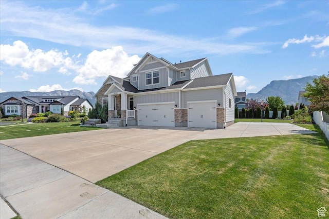 10262 N Yorkshire Cir, Highland, UT 84003 - craftsman-style house featuring driveway, a front lawn, stone siding, a mountain view, and a residential view