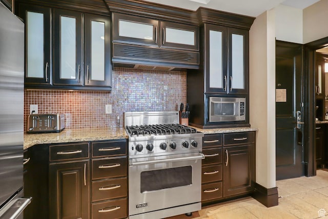 2100 W Frostwood Blvd Unit 5164, Park City, UT 84098 - kitchen featuring stainless steel appliances, decorative backsplash, light stone countertops, and glass insert cabinets