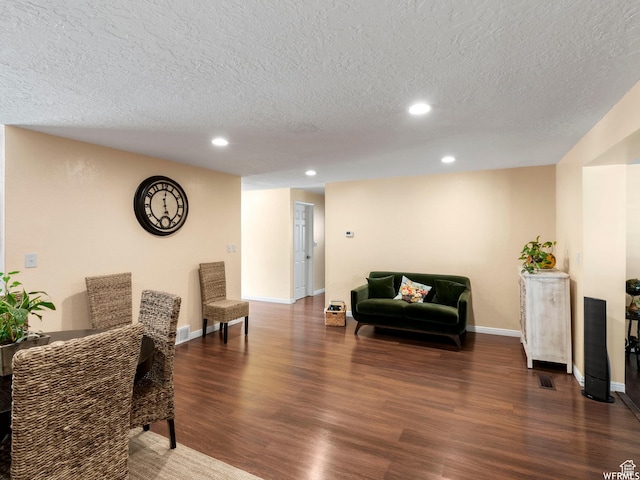 1034 E 1st St S, Ogden, UT 84404 - sitting room with wood finished floors, a textured ceiling, and recessed lighting