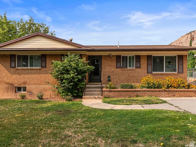 1034 E 1st St S, Ogden, UT 84404 - single story home with a front lawn and brick siding